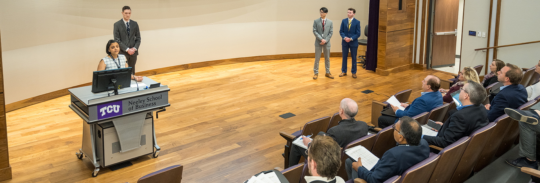 Section Image: Team Presenting in Shaddock Auditorium 