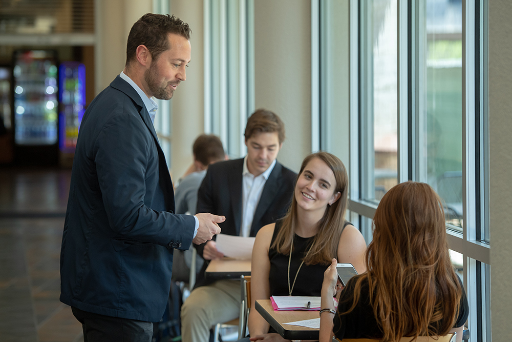 Zach Hall with students