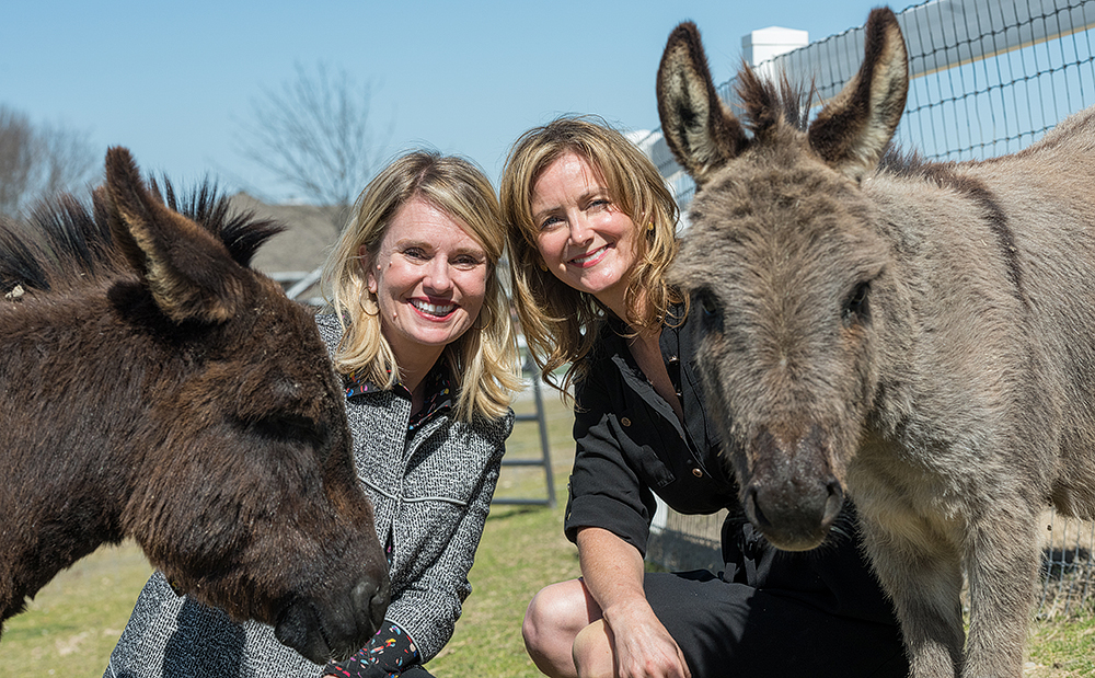 Shannon McLinden and Delia Faulk McLinden with donkeys