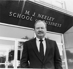 Kirk Downey in front of the Neeley School of Business