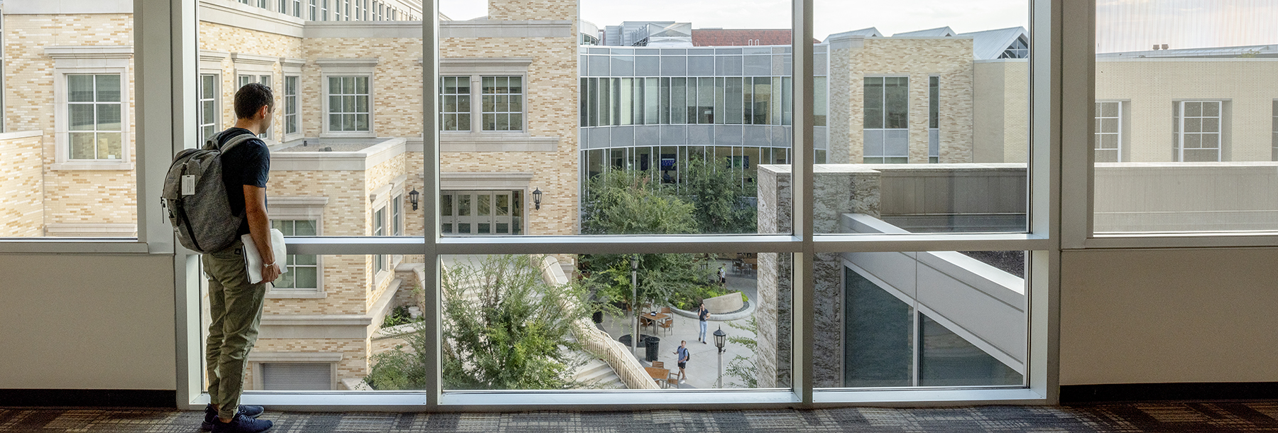 Section Image: Student looking out the window of Smith Hall 