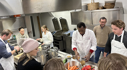 Section Image: Master of Accounting study abroad students around a table 