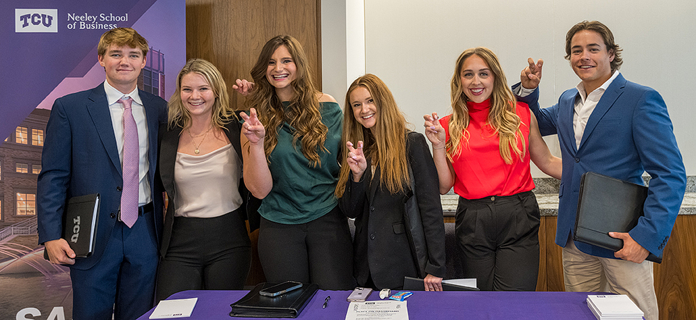 Section Image: Sales students with their frogs up 