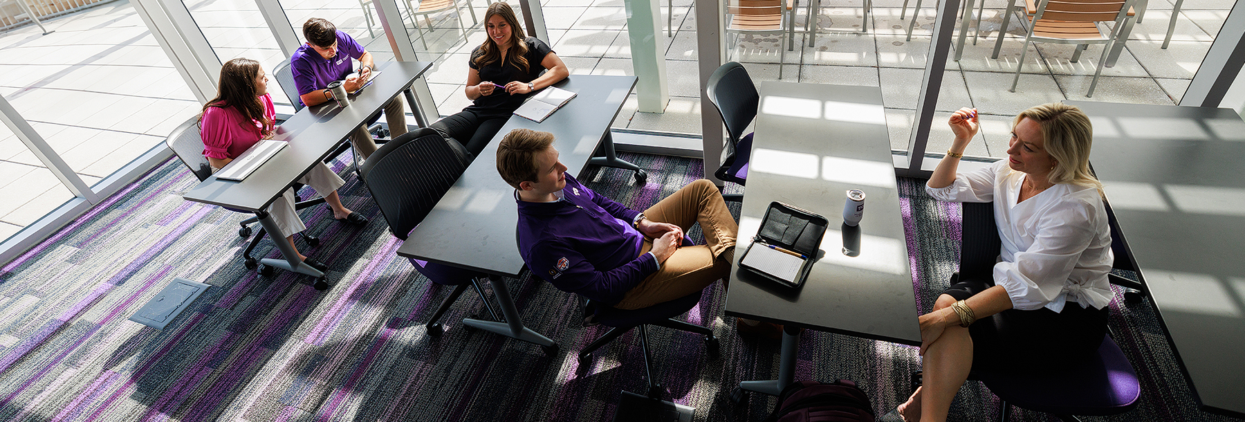 Section Image: students in a classroom discussion, including Kelly Tragger 