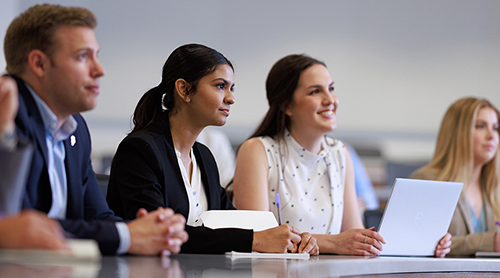 Section Image: Ariela Martinez speaks with students 