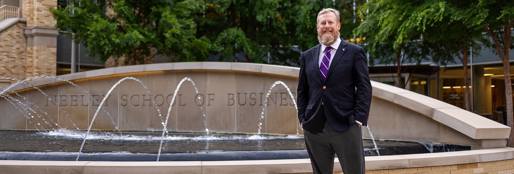Section Image: Craig Crossland in front of the Neeley Fountain 