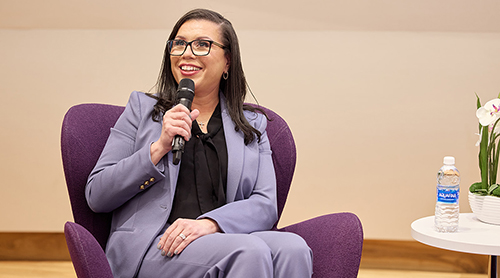 Section Image: Kalisha Holland with moderator Tracy Renee Williams on the stage of the Shaddock Auditorium 