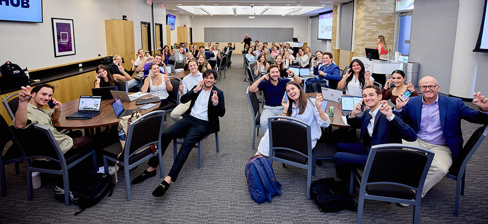 All of the sales students on their phones and with their Frogs Up