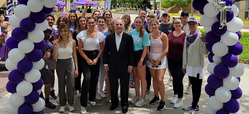 Section Image: Group of students backstage with Paul Evans 