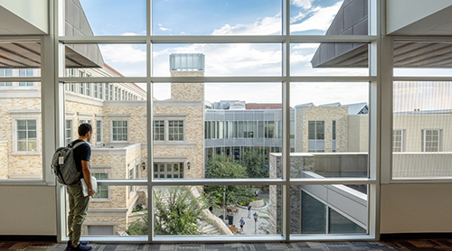 Student looking at view of Neeley School of Business