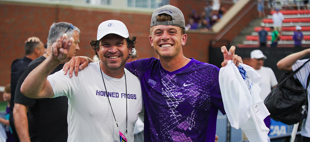 TCU President Daniel Pullin and Luke Swan with their frogs up