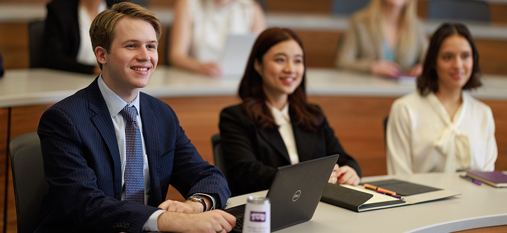 Students in suits in a lecture hall