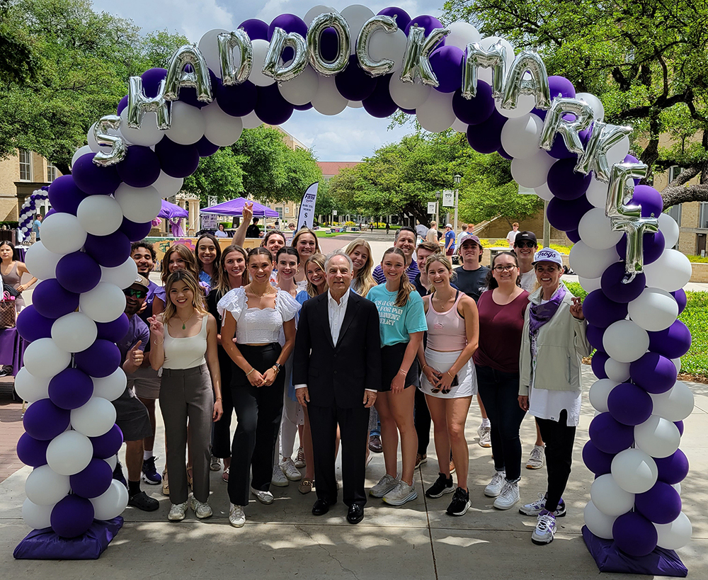 Group under Shaddock Market balloon arch