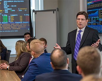 TCU Neeley finance professor presenting market analysis in class