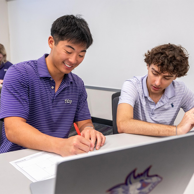 TCU Neeley undergraduate students taking notes in class