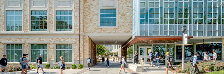 TCU Neeley School of Business buildings and students walking to class