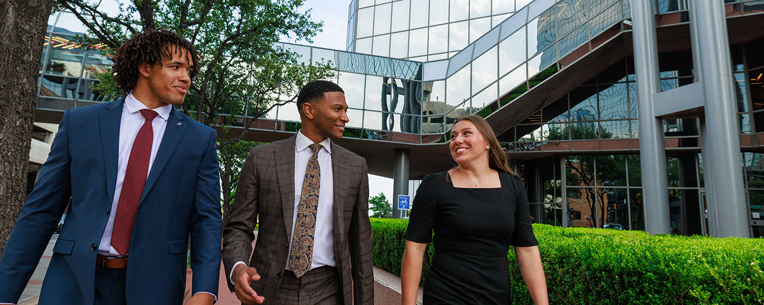 Three MBA students walking in downtown Fort Worth