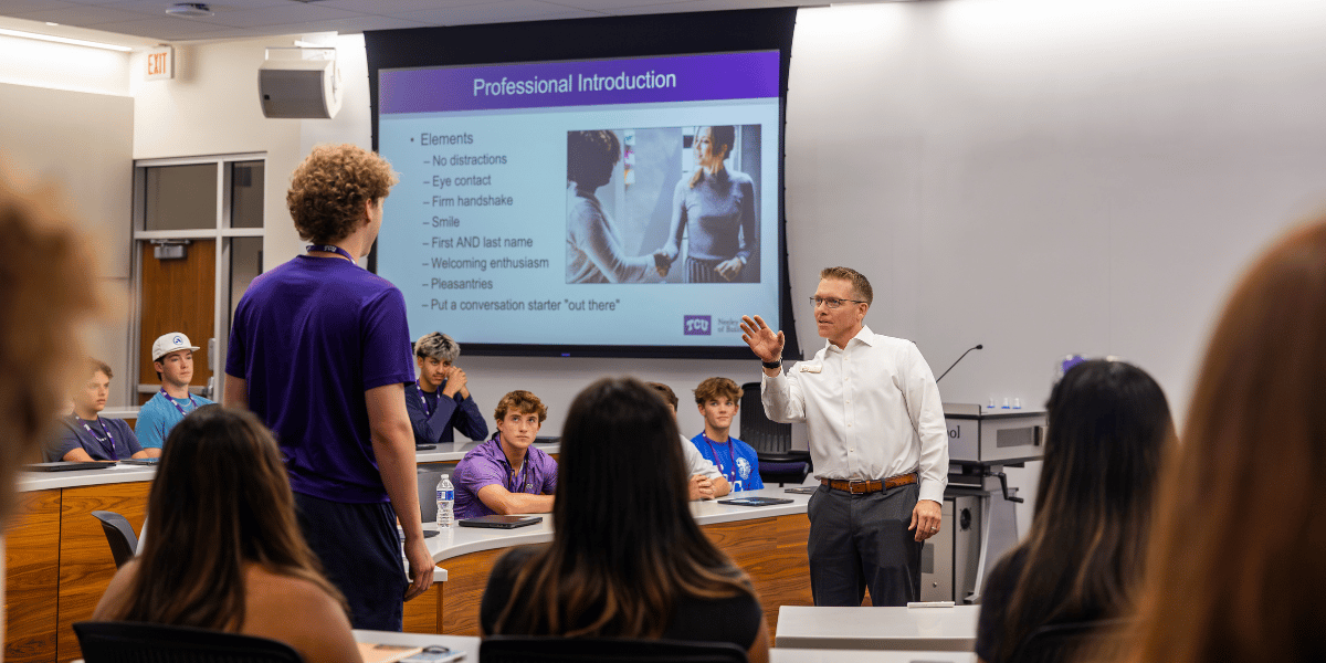 Associate Director for the Professional Development Center teaches new students in Neeley.