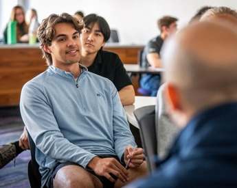 TCU Neeley Entrepreneurship and Innovation student conversing with professor