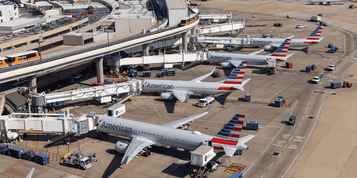 American Airlines planes stage at DFW airport terminals.