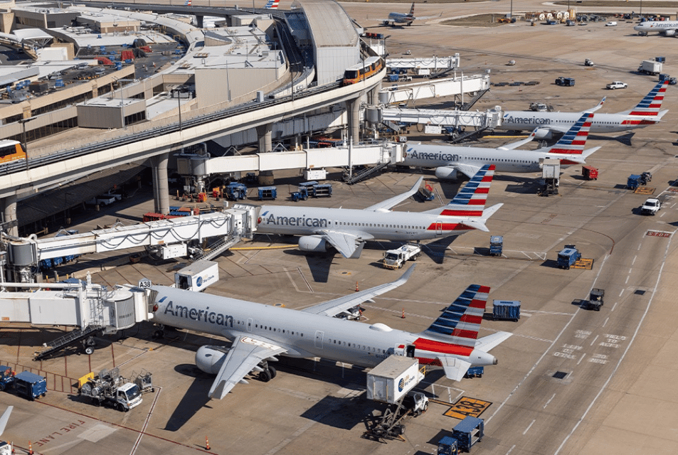American Airlines planes stage at DFW airport terminals. 