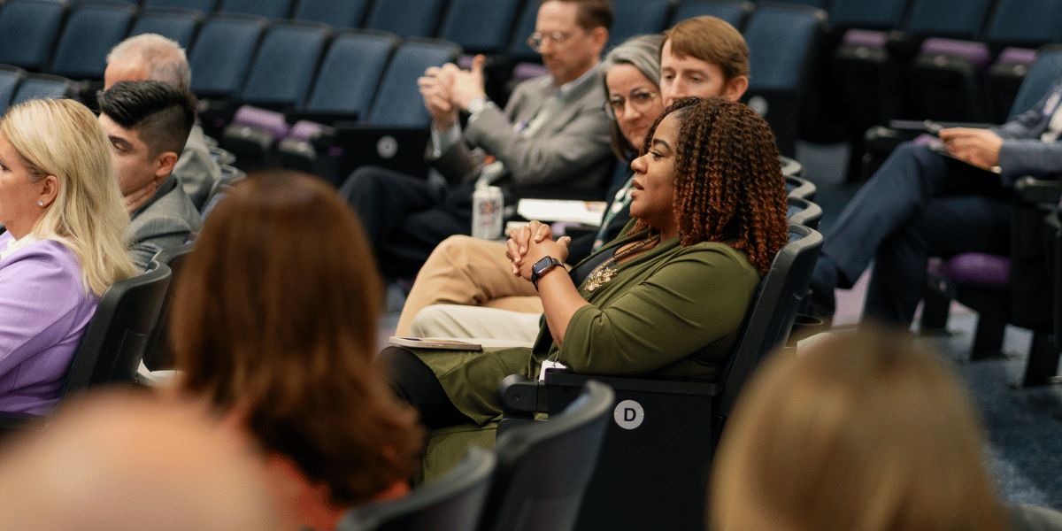 An audience of Executive Education student participants engage with faculty and colleagues.