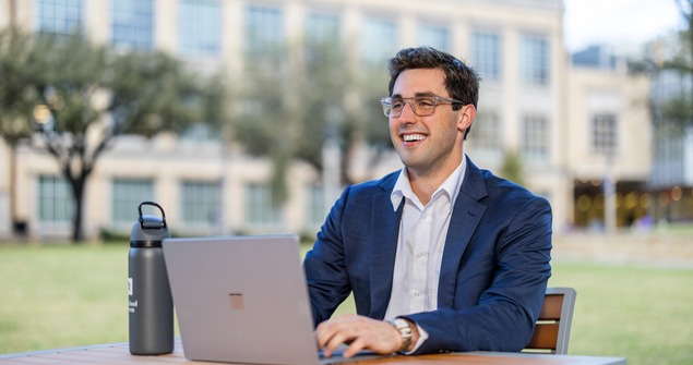 TCU Neeley School of Business graduate student on laptop