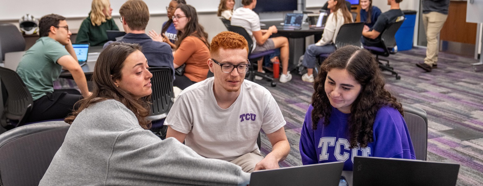 Students in small group discussion in Neeley class