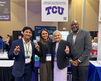Neeley students, faculty and alumni at Convergence AI Dallas conference in front of TCU's exhibit booth