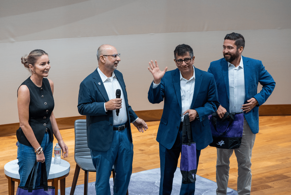 AI Symposium speakers present to audience of students, faculty and industry leaders. 