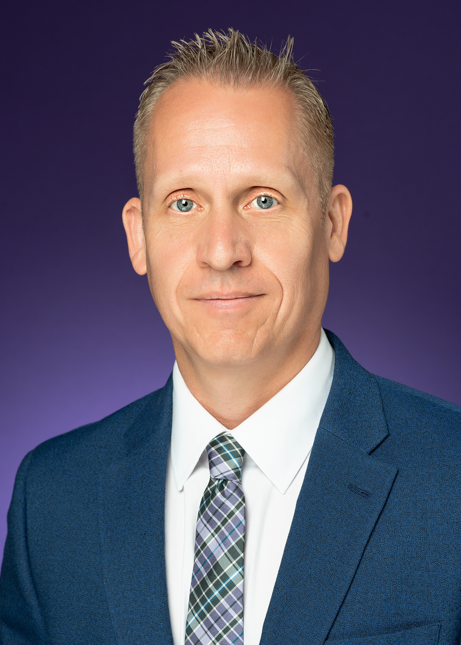 Headshot of Keith Hmieleski with the purple background.